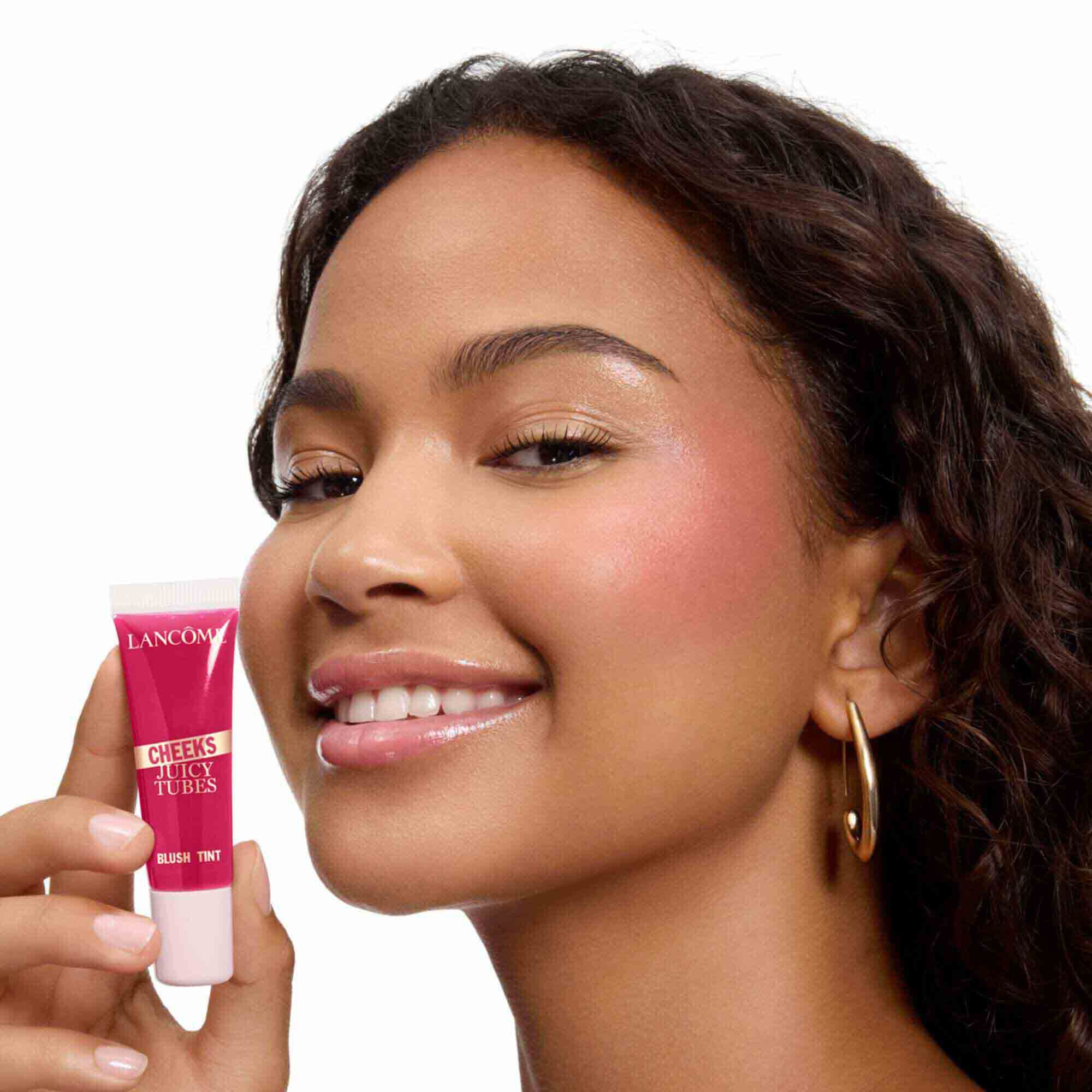Smiling model with a radiant pink cheek flush.