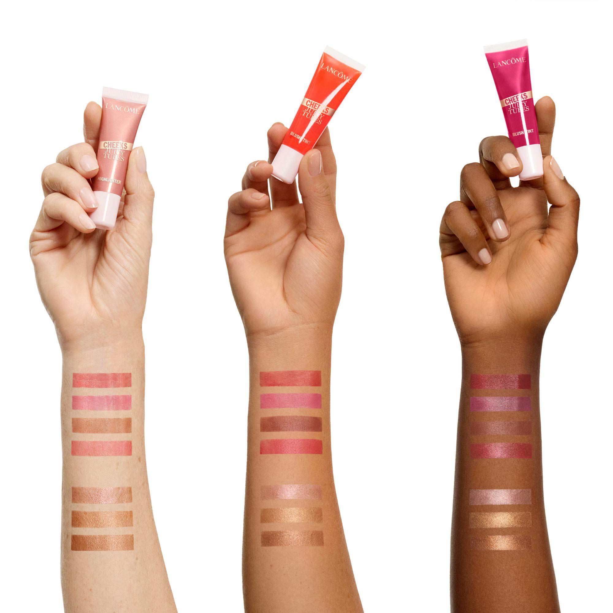 Five highlighter shades swatched on three different skin tones.