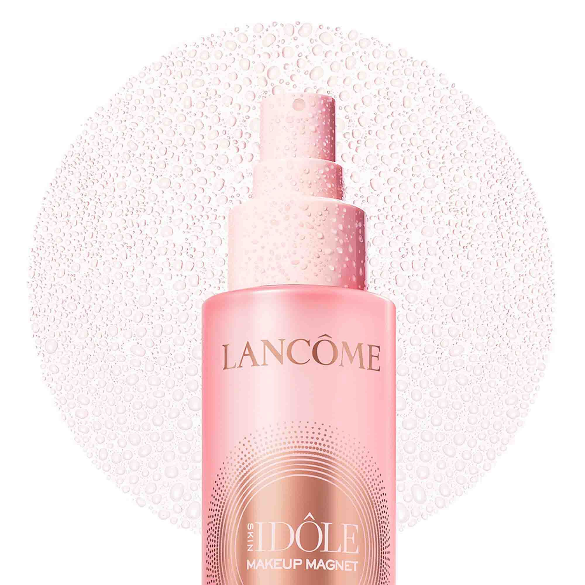 Top of pink bottle showing a fine circular mist spray.